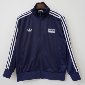 Oasis UK 2025-26 Chaqueta Camiseta